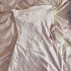 light pink satin minidress with cross tie back